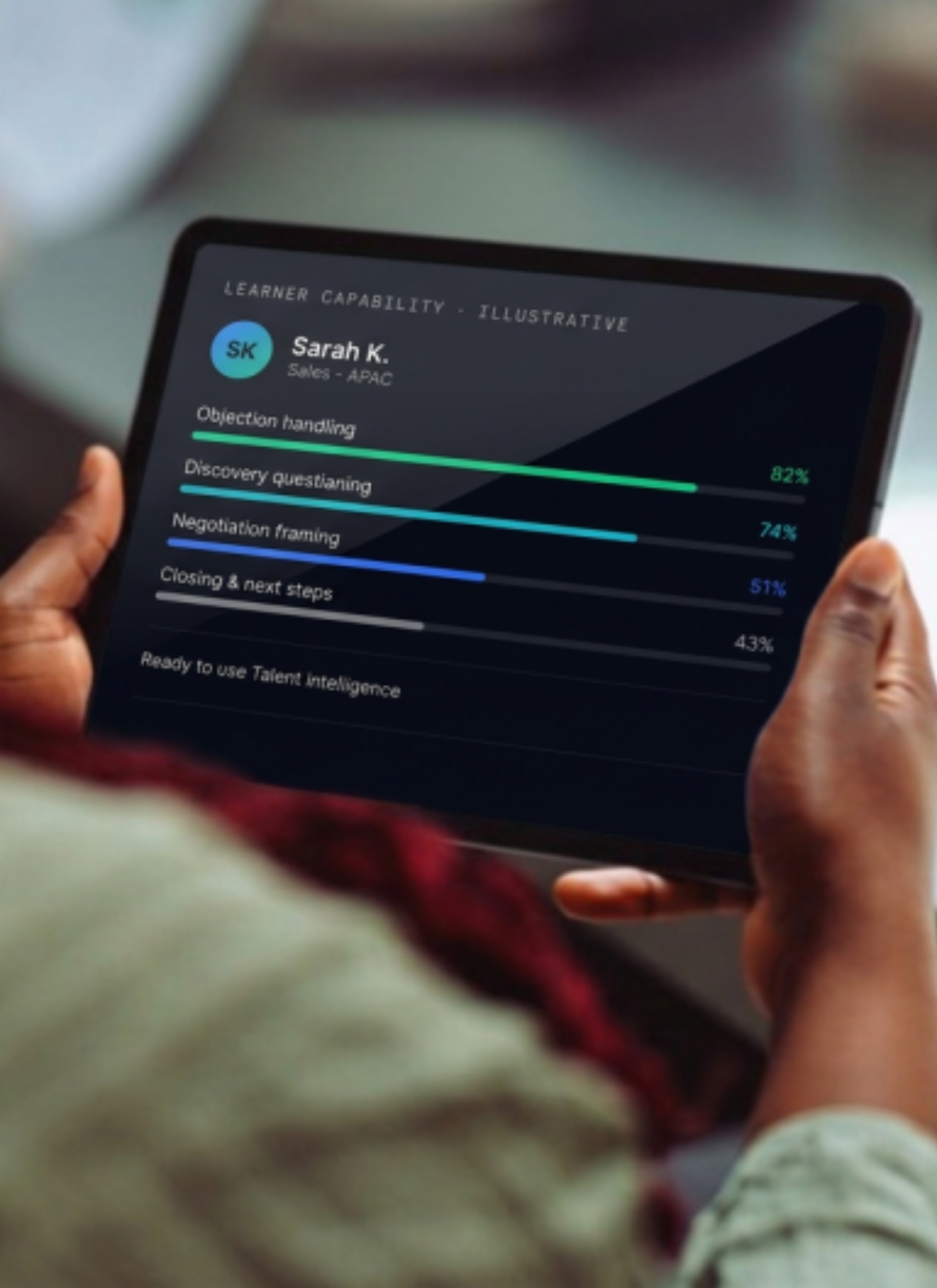 A tablet shows Sarah her simulation results