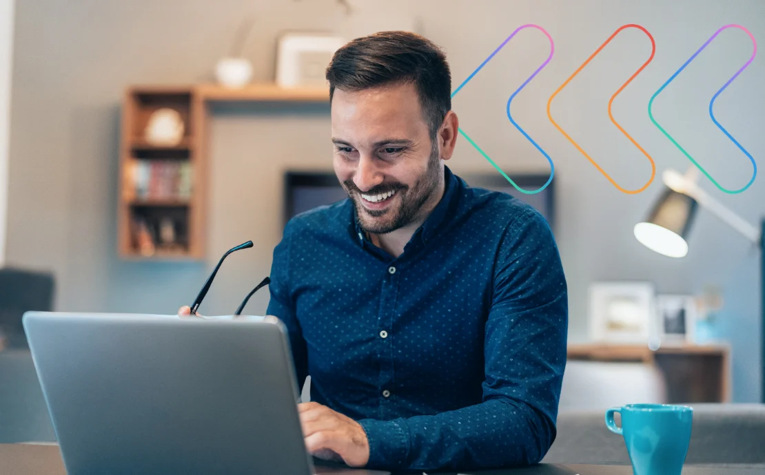 Designing microlearning blog banner: Man sat at a desk, smiling at a laptop, with Omniplex Learning icon in the background