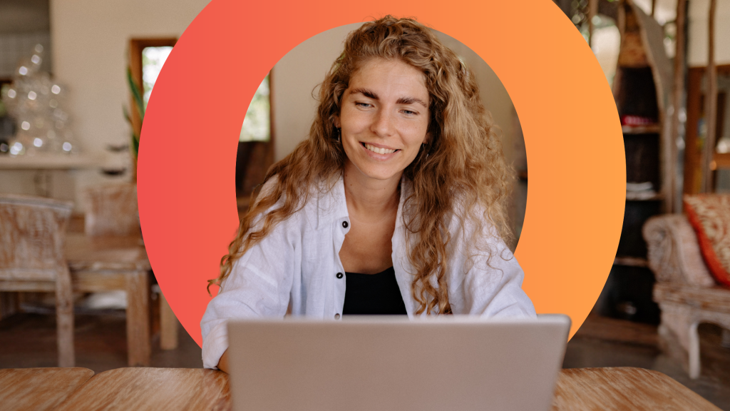 Nano learning blog hero image, woman sat at desk with laptop open, smiling