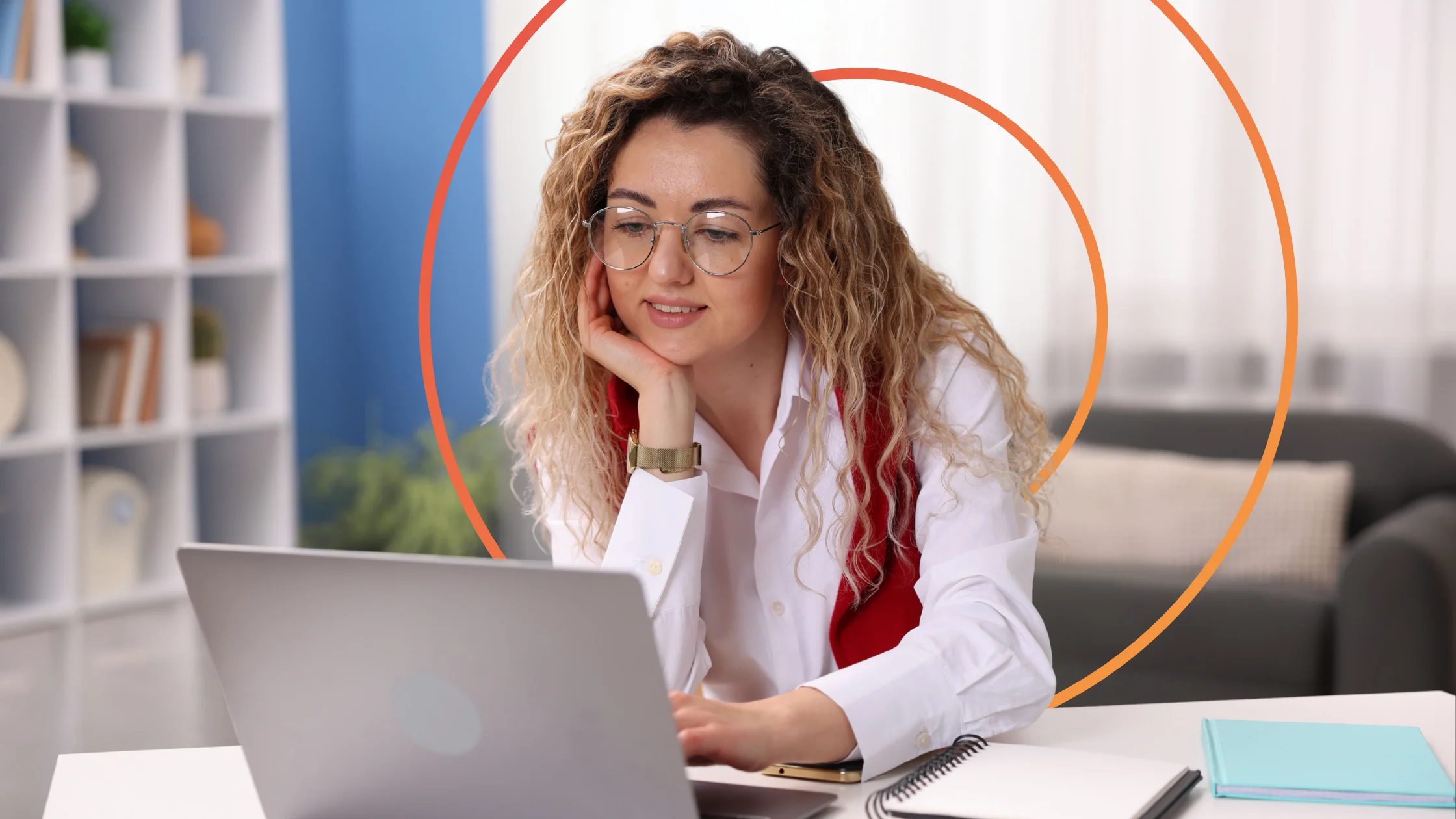 Woman working on laptop in her living room